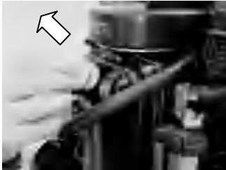 Oil draining from engine into container