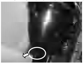 Loosening oil drain screw with container underneath